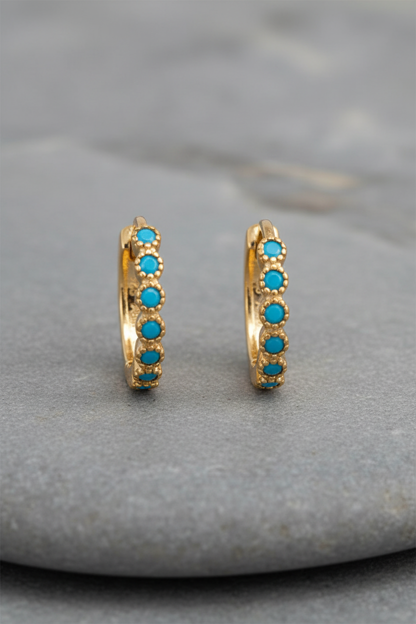 Turquoise sunset huggies on grey stone