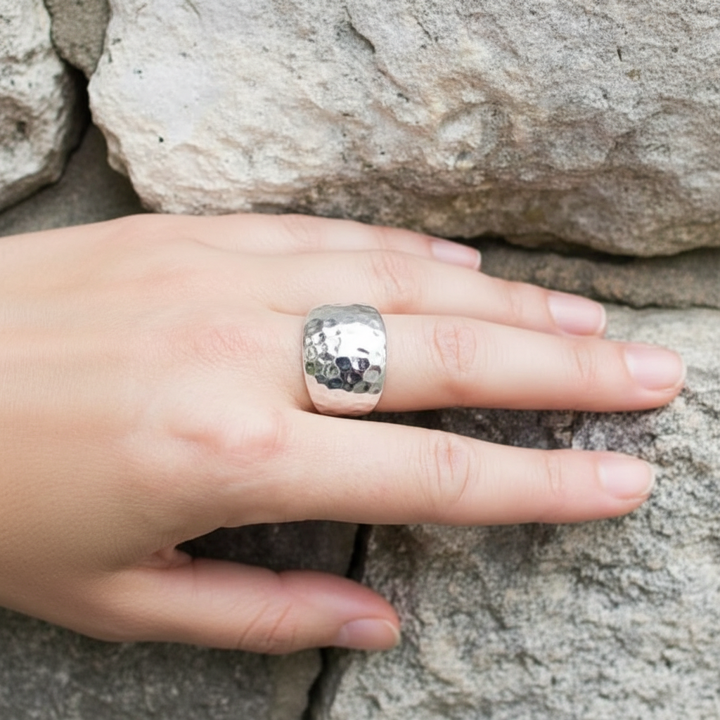 Wide Dome Hammered Bold Statement Ring Sterling Silver Female Model Hand Rock Stone Wall Background Clear Sharp Lifestyle 1x1